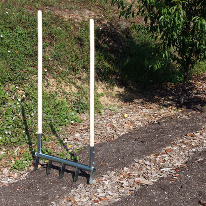 Broadfork Green Tools Tech with wooden handles and steel frame standing on a no-dig Market Garden bed