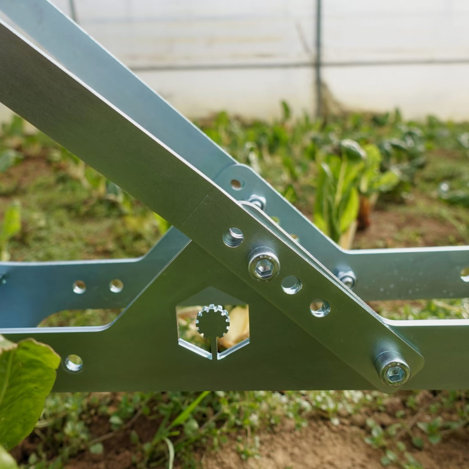 A close up of the Green Tools Tech Single Wheel Hoe galvanized zinc coated corrosion resistant metal structure