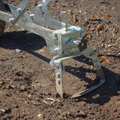 A close up of the Green Tools Tech Single Wheel Hoe 20 cm swing hoe blade for efficient no-dig market garden weeding and soil cultivation