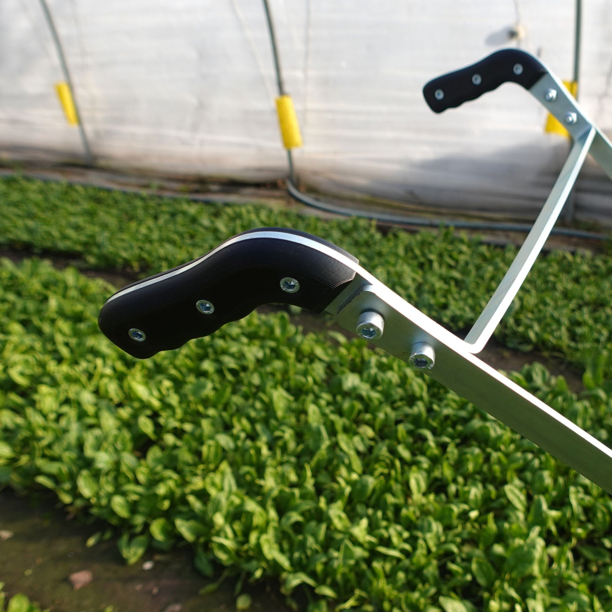 A close up of the Green Tools Tech Single Wheel Hoe handles 